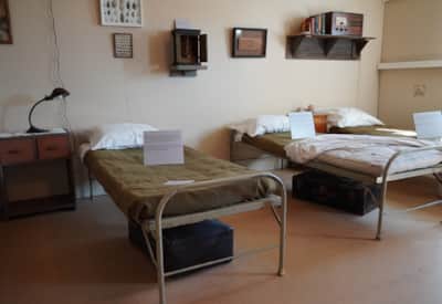 Visitors can enter a restored example of living quarters in the barracks