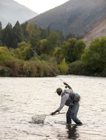 Fisherman fly fishing in the Provo River.